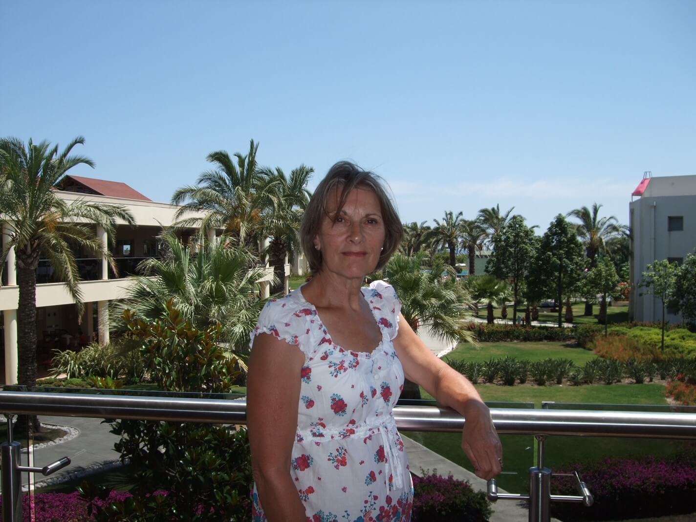 Lorna England on a balcony on holiday